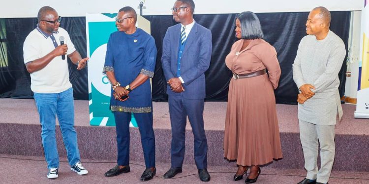 Chairman of the new CFLE Advisory Board, John Awuah [L] in a discussion with fellow board members