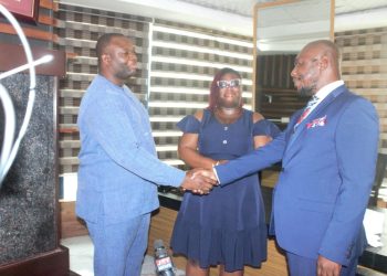 Bernard Owusu-Twumasi [Right] in a handshake with UGSoL's Kwame Awadzie